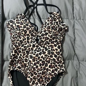 One piece swim suit. Cheetah print. Size 12-14.